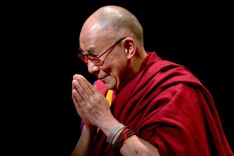 Exiled Tibetan spiritual leader The Dalai Lama greets the audience after speaking on "The Virtue of Non-Violence" at The Beacon Theatre in N Exiled Tibetan spiritual leader The Dalai Lama greets the audience after speaking on "The Virtue of Non-Violence" at The Beacon Theatre in N