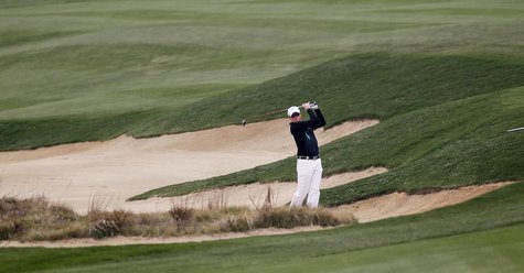 Simon Dyson of Britain hits out of a sand trap on the seventh hole during the BMW Masters 2013 golf tournament at Lake Malaren Golf Club in Simon Dyson of Britain hits out of a sand trap on the seventh hole during the BMW Masters 2013 golf tournament at Lake Malaren Golf Club in