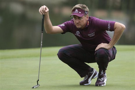 Ian Poulter of England looks over his putt on the 18th green during the third round of the WGC-HSBC Champions golf tournament in Shanghai No Ian Poulter of England looks over his putt on the 18th green during the third round of the WGC-HSBC Champions golf tournament in Shanghai No