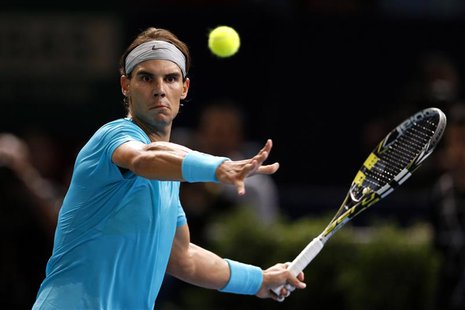 Rafael Nadal of Spain eyes the ball before returning to compatriot Marcel Granollers at the Paris Masters men's singles tennis tournament at Rafael Nadal of Spain eyes the ball before returning to compatriot Marcel Granollers at the Paris Masters men's singles tennis tournament at