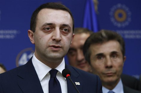 Georgia's Interior Minister Irakly Garibashvili speaks during a news conference as Prime Minister Bidzina Ivanishvili looks on in Tbilisi, N Georgia's Interior Minister Irakly Garibashvili speaks during a news conference as Prime Minister Bidzina Ivanishvili looks on in Tbilisi, N