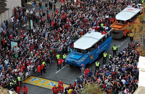 Nov 2, 2013; Boston, MA, USA; An overhead view as duck boats carry Boston Red Sox players across the marathon finish line during the World S Nov 2, 2013; Boston, MA, USA; An overhead view as duck boats carry Boston Red Sox players across the marathon finish line during the World S