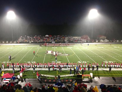 The Lakeshore Lancers (foreground) and Coldwater Cardinals (background) line up before their MHSAA Division 3 Football Pre-District game at Al Stockman Stadium in Stevensville, MI on November 1, 2013. The Lakeshore Lancers (foreground) and Coldwater Cardinals (background) line up before their MHSAA Division 3 Football Pre-District game at Al Stockman Stadium in Stevensville, MI on November 1, 2013.