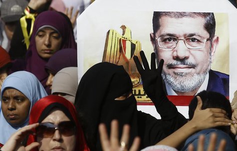 Supporters of the Muslim Brotherhood and ousted Egyptian President Mohamed Mursi take part in a protest against the military and interior mi Supporters of the Muslim Brotherhood and ousted Egyptian President Mohamed Mursi take part in a protest against the military and interior mi