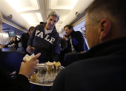 U.S. Secretary of State John Kerry offers cupcakes to members of the travelling press between Washington and the Middle East, November 2, 20 U.S. Secretary of State John Kerry offers cupcakes to members of the travelling press between Washington and the Middle East, November 2, 20