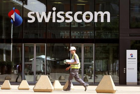 The logo of Swiss telecom company Swisscom AG is seen at an office building in Zurich July 19, 2013. REUTERS/Arnd Wiegmann The logo of Swiss telecom company Swisscom AG is seen at an office building in Zurich July 19, 2013. REUTERS/Arnd Wiegmann