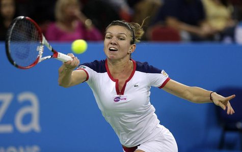 Simona Halep of Romania returns a shot to Samantha Stosur of Australia during the Tournament of Champions women's singles final tennis match Simona Halep of Romania returns a shot to Samantha Stosur of Australia during the Tournament of Champions women's singles final tennis match