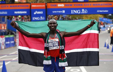 Geoffrey Mutai of Kenya holds up the Kenyan flag after winning the men's division of the New York City Marathon in New York, November 3, 201 Geoffrey Mutai of Kenya holds up the Kenyan flag after winning the men's division of the New York City Marathon in New York, November 3, 201