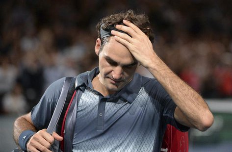 Roger Federer of Switzerland leaves the court after being defeated by Novak Djokovic of Serbia in their semi-final match at the Paris Master Roger Federer of Switzerland leaves the court after being defeated by Novak Djokovic of Serbia in their semi-final match at the Paris Master