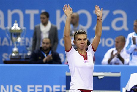 Simona Halep of Romania celebrates defeating Samantha Stosur of Australia during the WTA Tournament of Champions final match in Sofia Novemb Simona Halep of Romania celebrates defeating Samantha Stosur of Australia during the WTA Tournament of Champions final match in Sofia Novemb