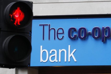 A red crossing light is pictured next to a branch of the Co-operative Bank in London October 21, 2013. REUTERS/Luke MacGregor A red crossing light is pictured next to a branch of the Co-operative Bank in London October 21, 2013. REUTERS/Luke MacGregor