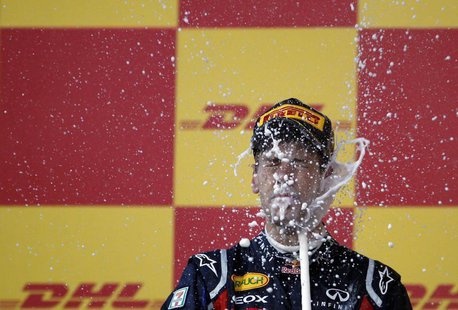 Red Bull Formula One driver Sebastian Vettel of Germany celebrates winning the world championship after finishing third in the Japanese F1 G Red Bull Formula One driver Sebastian Vettel of Germany celebrates winning the world championship after finishing third in the Japanese F1 G