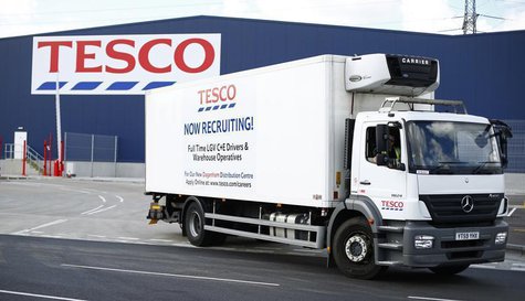 A lorry with job advertisements on its side leaves a Tesco distribution centre in Dagenham, east London August 12, 2013. REUTERS/Andrew Winn A lorry with job advertisements on its side leaves a Tesco distribution centre in Dagenham, east London August 12, 2013. REUTERS/Andrew Winn