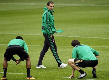 AC Milan's coach Massimiliano Allegri smiles as he walks during a training session at the Milanello training center in Carnago, northern Ita AC Milan's coach Massimiliano Allegri smiles as he walks during a training session at the Milanello training center in Carnago, northern Ita