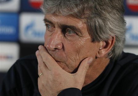 Manchester City's manager Manuel Pellegrini listens to questions during a news conference at the club's Carrington training complex in Manch Manchester City's manager Manuel Pellegrini listens to questions during a news conference at the club's Carrington training complex in Manch