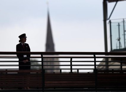 A G4S security guard watches over some of the courts at the Wimbledon Tennis Championships, in London June 26, 2013. REUTERS/Eddie Keogh A G4S security guard watches over some of the courts at the Wimbledon Tennis Championships, in London June 26, 2013. REUTERS/Eddie Keogh