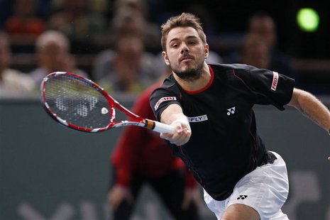 Stanislas Wawrinka of Switzerland prepares to return to Novak Djokovic of Serbia at the Paris Masters men's singles tennis tournament at the Stanislas Wawrinka of Switzerland prepares to return to Novak Djokovic of Serbia at the Paris Masters men's singles tennis tournament at the