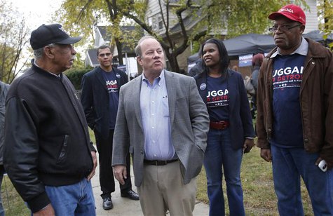 Mayoral candidate Mike Duggan (C) meets with supporters during a campaign stop in his childhood neighborhood in Detroit, Michigan November 2 Mayoral candidate Mike Duggan (C) meets with supporters during a campaign stop in his childhood neighborhood in Detroit, Michigan November 2