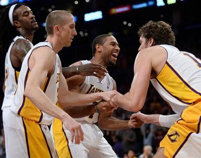 Nov 3, 2013; Los Angeles, CA, USA; Los Angeles Lakers shooting guard Xavier Henry (7) smiles as he helps up teammate Paul Gasol (16, right) Nov 3, 2013; Los Angeles, CA, USA; Los Angeles Lakers shooting guard Xavier Henry (7) smiles as he helps up teammate Paul Gasol (16, right)
