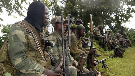Congolese soldiers rest while being deployed against the M23 rebels near Bunagana, north of Goma, November 1, 2013. REUTERS/Kenny Katombe Congolese soldiers rest while being deployed against the M23 rebels near Bunagana, north of Goma, November 1, 2013. REUTERS/Kenny Katombe
