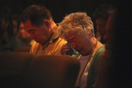 Sung Seo and Myunghee Bae, parents of Kenneth Bae during a vigil for Kenneth in Seattle, Washington August 10, 2013. REUTERS/Matt Mills McKn Sung Seo and Myunghee Bae, parents of Kenneth Bae during a vigil for Kenneth in Seattle, Washington August 10, 2013. REUTERS/Matt Mills McKn