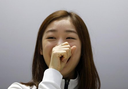 South Korean figure skater Kim Yuna smiles as she listens to questions during a news conference ahead of Sochi 2014 Winter Olympics, at the South Korean figure skater Kim Yuna smiles as she listens to questions during a news conference ahead of Sochi 2014 Winter Olympics, at the