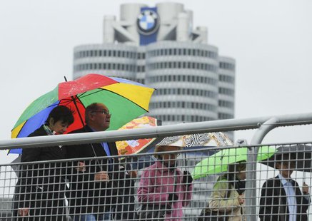 Shareholders arrive for the German luxury carmaker BMW annual shareholders meeting at the company's headquarters in Munich, May 16, 2012 May Shareholders arrive for the German luxury carmaker BMW annual shareholders meeting at the company's headquarters in Munich, May 16, 2012 May