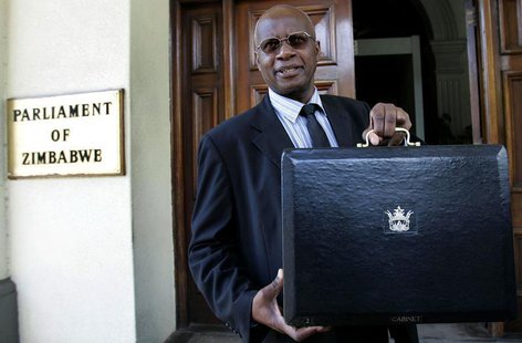Zimbabwe's Patrick Chinamasa holds up a briefcase containing the government's budget at the Parliament buildings in Harare, January 29, 2009 Zimbabwe's Patrick Chinamasa holds up a briefcase containing the government's budget at the Parliament buildings in Harare, January 29, 2009