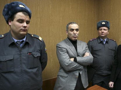 Opposition leader Garry Kasparov (C) speaks during a court hearing after he was detained during Saturday's opposition march in Moscow Novemb Opposition leader Garry Kasparov (C) speaks during a court hearing after he was detained during Saturday's opposition march in Moscow Novemb