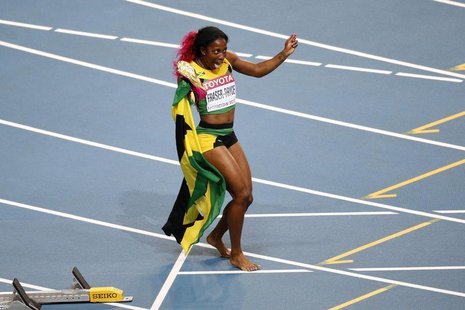 Shelly-Ann Fraser-Pryce of Jamaica celebrates winning the women's 100 metres final during the IAAF World Athletics Championships at the Luzh Shelly-Ann Fraser-Pryce of Jamaica celebrates winning the women's 100 metres final during the IAAF World Athletics Championships at the Luzh