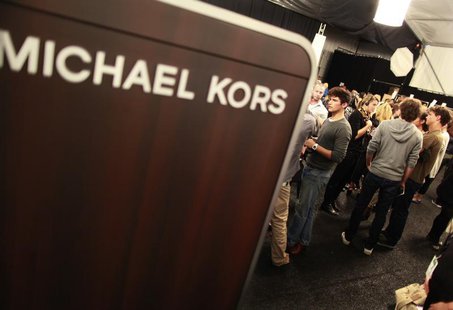 Models and staff prepare backstage before the Michael Kors Spring 2011 collection during New York Fashion Week September 15, 2010. REUTERS/B Models and staff prepare backstage before the Michael Kors Spring 2011 collection during New York Fashion Week September 15, 2010. REUTERS/B