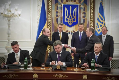 (L-R, front) Chevron Exploration and Production Europe Derek Magness, Ukraine's Energy Minister Eduard Stavytsky, Chairman of the National J (L-R, front) Chevron Exploration and Production Europe Derek Magness, Ukraine's Energy Minister Eduard Stavytsky, Chairman of the National J