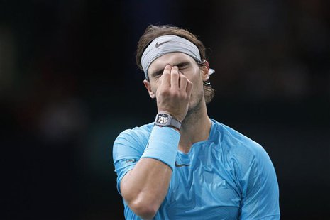 Rafael Nadal of Spain reacts as he faces David Ferrer of Spain in their semi-final match of the Paris Masters men's singles tennis tournamen Rafael Nadal of Spain reacts as he faces David Ferrer of Spain in their semi-final match of the Paris Masters men's singles tennis tournamen