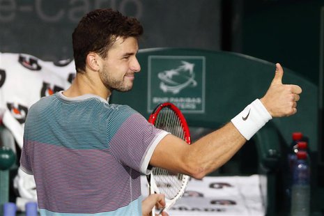 Grigor Dimitrov of Bulgaria gives the thumbs up after defeating Michael Llodra of France in their opening round match at the Paris Masters m Grigor Dimitrov of Bulgaria gives the thumbs up after defeating Michael Llodra of France in their opening round match at the Paris Masters m