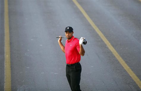 U.S. golfer Tiger Woods poses during an event to promote the upcoming Turkish Airlines Open golf tournament, on the Bosphorus Bridge that li U.S. golfer Tiger Woods poses during an event to promote the upcoming Turkish Airlines Open golf tournament, on the Bosphorus Bridge that li