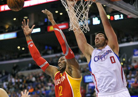 Los Angeles, CA, USA; Houston Rockets center Dwight Howard (12) and Los Angeles Clippers center Byron Mullens (0) play for the rebound durin Los Angeles, CA, USA; Houston Rockets center Dwight Howard (12) and Los Angeles Clippers center Byron Mullens (0) play for the rebound durin