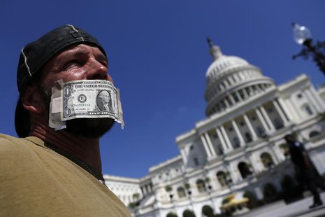 John Zangas, who identified himself as a federal employee, protests against the current government shutdown at the U.S. Capitol in Washingto John Zangas, who identified himself as a federal employee, protests against the current government shutdown at the U.S. Capitol in Washingto