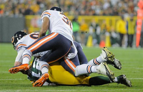 Green Bay, WI, USA; Chicago Bears defensive end Shea McClellin (99) and cornerback Isaiah Frey (31) sacks Green Bay Packers quarterback Aaro Green Bay, WI, USA; Chicago Bears defensive end Shea McClellin (99) and cornerback Isaiah Frey (31) sacks Green Bay Packers quarterback Aaro