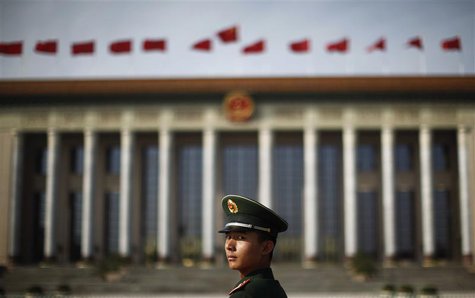 A paramilitary police officer stands in front of the Great Hall of the People at Beijing's Tiananmen Square, in this file picture taken Nove A paramilitary police officer stands in front of the Great Hall of the People at Beijing's Tiananmen Square, in this file picture taken Nove