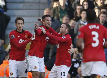 Manchester United's Robin Van Persie (L) celebrates with team-mate Wayne Rooney (R) after scoring a goal against Fulham during their English Manchester United's Robin Van Persie (L) celebrates with team-mate Wayne Rooney (R) after scoring a goal against Fulham during their English