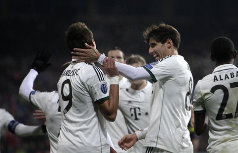 Bayern Munich's Mario Mandzukic (L) celebrates with his team mate Javi Martinez after scoring a goal against Viktoria Plzen during their Cha Bayern Munich's Mario Mandzukic (L) celebrates with his team mate Javi Martinez after scoring a goal against Viktoria Plzen during their Cha