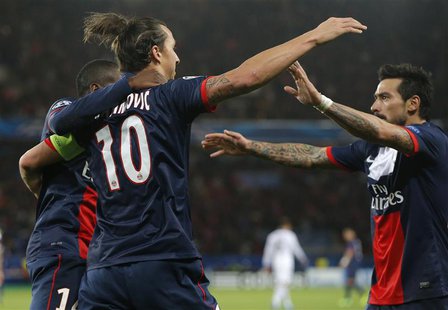 Paris St-Germain's Zlatan Ibrahimovic (L) celebrates with team mates after scoring his team's first goal during their Champions League socce Paris St-Germain's Zlatan Ibrahimovic (L) celebrates with team mates after scoring his team's first goal during their Champions League socce