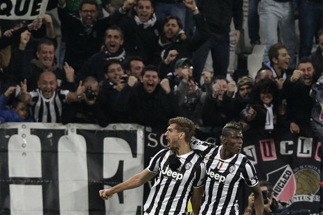 Juventus Fernando Llorente (L) celebrates with his teammate Paul Pogba after scoring against Real Madrid during their Champions League socce Juventus Fernando Llorente (L) celebrates with his teammate Paul Pogba after scoring against Real Madrid during their Champions League socce