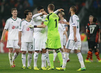 Bayer Leverkusen's players greet each other after their Champions League soccer match against Shakhtar Donetsk at the Donbass Arena stadium Bayer Leverkusen's players greet each other after their Champions League soccer match against Shakhtar Donetsk at the Donbass Arena stadium