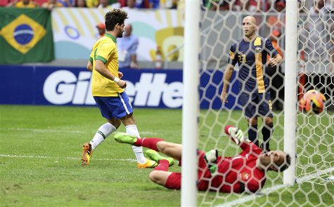Brazil's Alexandre Pato (L) scores his goal against Australia's goalkeeper Mark Schwarzer during their international friendly soccer match i Brazil's Alexandre Pato (L) scores his goal against Australia's goalkeeper Mark Schwarzer during their international friendly soccer match i