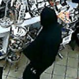Image from surveillance camera video of suspect robbing the Shell station on River Ave. at 16th Street in Holland on Nov. 4, 2013. (photo courtesy Holland Public Safety) Image from surveillance camera video of suspect robbing the Shell station on River Ave. at 16th Street in Holland on Nov. 4, 2013. (photo courtesy Holland Public Safety)