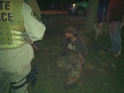 Photo 2 is John Abolt (dark clothing) as he is taken into custody.
photo courtesy of Indiana State Police Photo 2 is John Abolt (dark clothing) as he is taken into custody.
photo courtesy of Indiana State Police