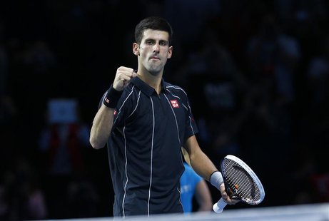 Novak Djokovic of Serbia celebrates after defeating Roger Federer of Switzerland in their men's singles tennis match at the ATP World Tour F Novak Djokovic of Serbia celebrates after defeating Roger Federer of Switzerland in their men's singles tennis match at the ATP World Tour F