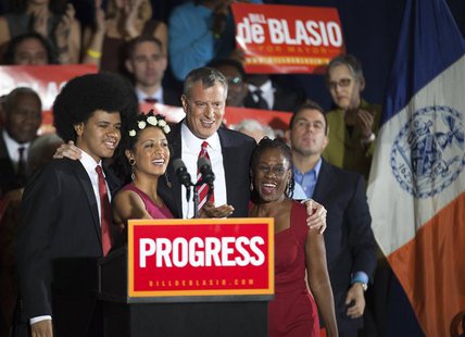 Liberal Democrat Bill de Blasio (2nd R) hugs his wife Chirlane (R) and children Chiara and Dante during his election victory party at the Pa Liberal Democrat Bill de Blasio (2nd R) hugs his wife Chirlane (R) and children Chiara and Dante during his election victory party at the Pa