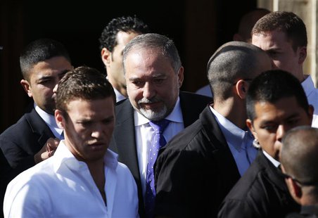 Former Israeli Foreign Minister Avigdor Lieberman (C) leaves the Magistrate Court in Jerusalem after hearing the verdict in the corruption c Former Israeli Foreign Minister Avigdor Lieberman (C) leaves the Magistrate Court in Jerusalem after hearing the verdict in the corruption c